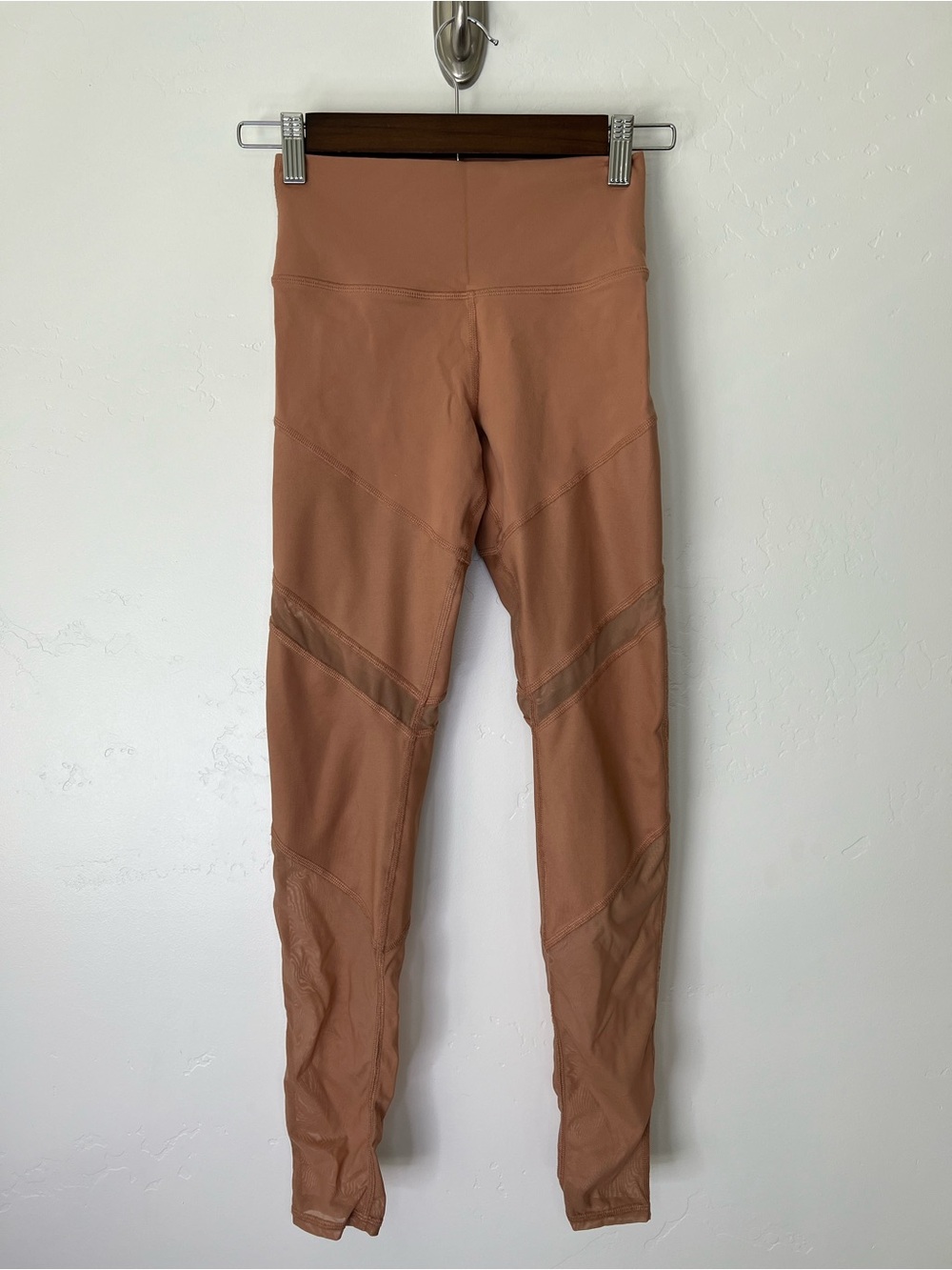 ALO leggings in henna color with sheer cut outs